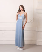 Frontal view of a blue nightgown with a flattering V-neck and ivory lace embellishments on the chest.