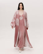 A dynamic view of the flowing silhouette, showcasing how the velvet drapes beautifully during movement.