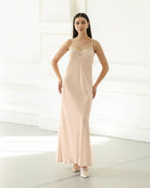 Standing in a lace-trimmed nightdress with hands on the hips, highlighting the soft texture and comfortable fit.