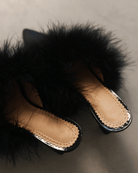 A rear view of the Satin Slippers, highlighting the 5 cm heel and how the soft feathers sway beautifully.