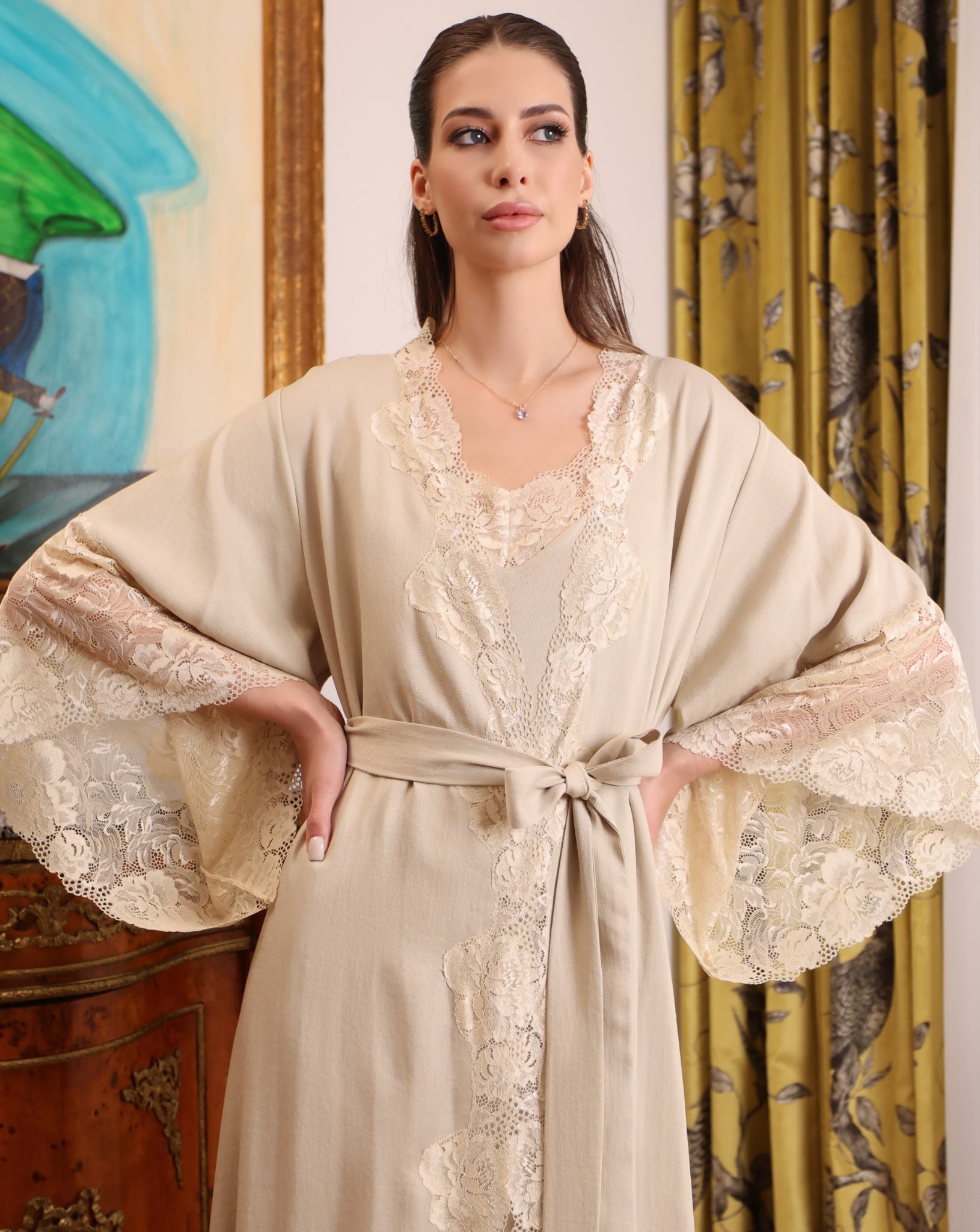 Mid-length shot of the Cotton Robe with a sash tie, emphasizing the defined waist and architectural lace details.