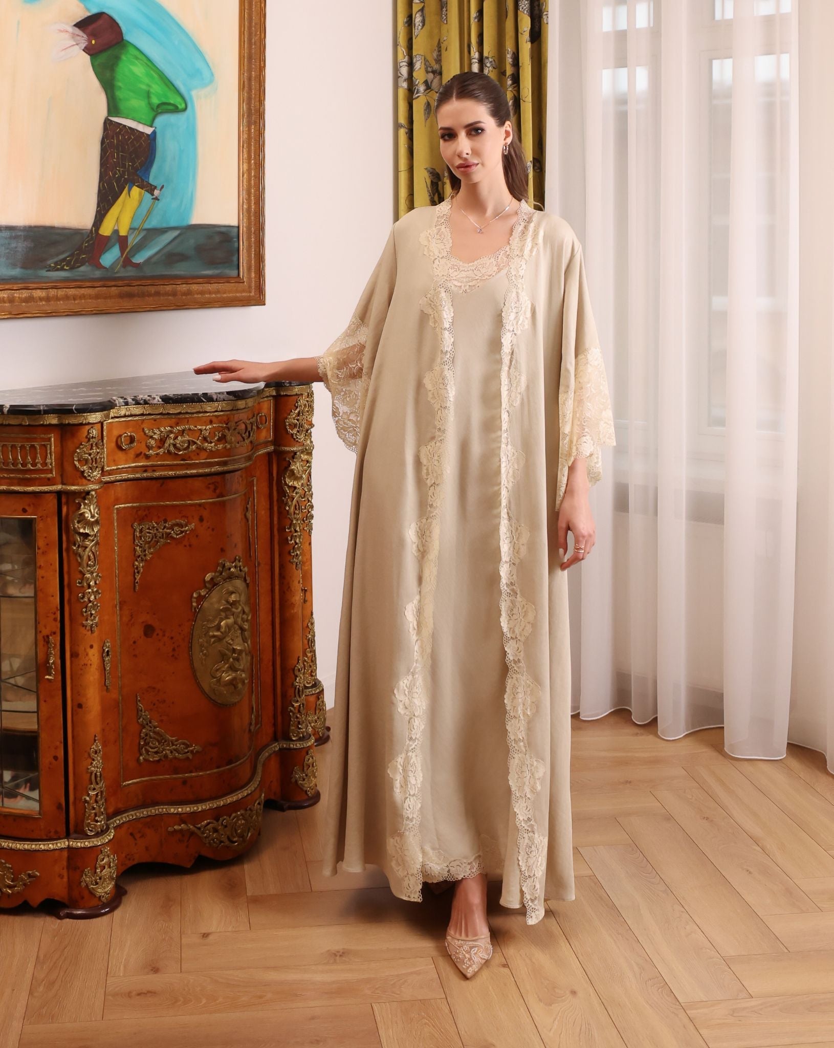 A poised shot of the Cotton Robe set by a bedside table, illustrating timeless elegance and grounded comfort.