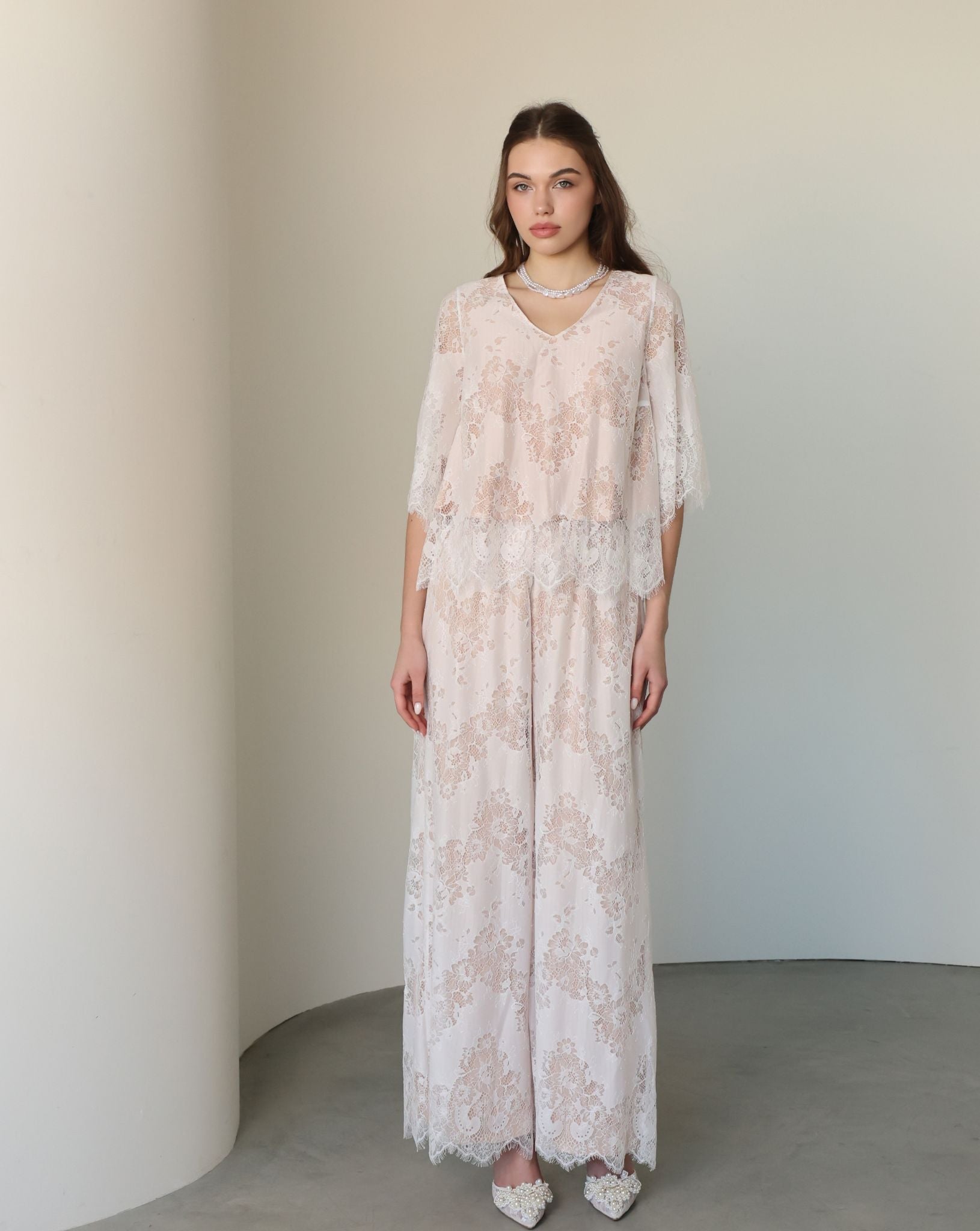 A poised frontal view of the set, highlighting the lightweight cotton fabric and delicate lace layer.