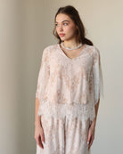 Mid-length shot of the Cotton Pyjamas, capturing the balance of timeless elegance and total freedom of movement.