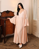 An atmospheric full-length shot of the Cotton Robe set, highlighting its serene presence and natural comfort.