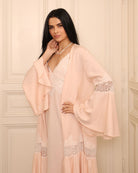 A poised mid-length shot of the Cotton Robe, highlighting the tie belt that defines the waist without restriction.