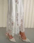 Detailed view of lace embroidery on silk nightgown by Kafemme