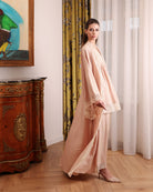 A side perspective of the complete layered set, illustrating the effortless comfort and timeless charm of the design.