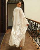 Rear perspective of the flowing silk wrap, emphasizing the timeless elegance and heavenly silhouette of the set.