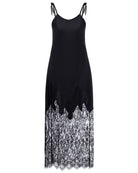 Frontal shot of a long nightdress on a plain background, featuring thin straps and a wide band of exquisite lace.