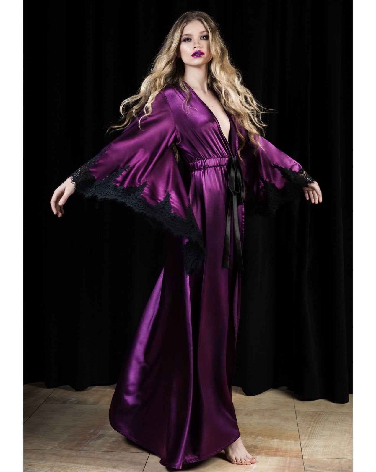 A dynamic view of the floor-length wrap in motion, capturing the liquid-like rhythm of the heavy, flowing silk.